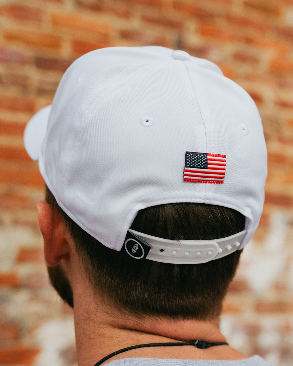 Man wearing white 1776 USA feather fit hat